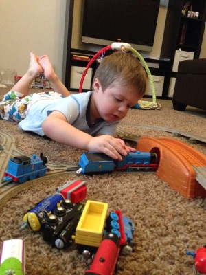 Hayden playing with his new train set