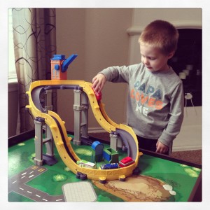 Ian playing with his new car ramp
